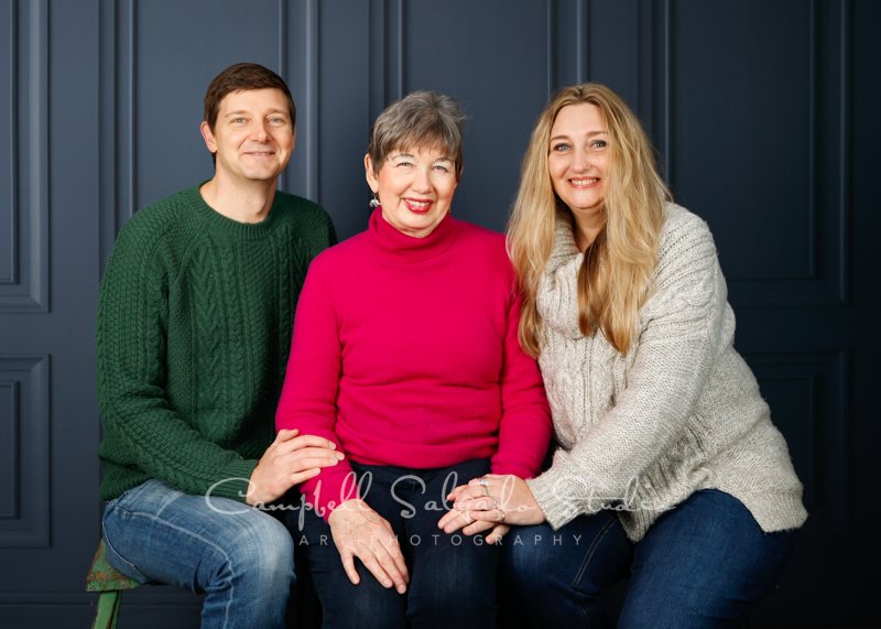  Portrait of family on Portland Parlour background by family photographers at Campbell Salgado Studio in Portland, Oregon.  