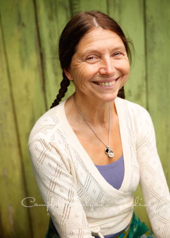  Portrait of individual on lime fenceboards background by individual photographers at Campbell Salgado Studio.   