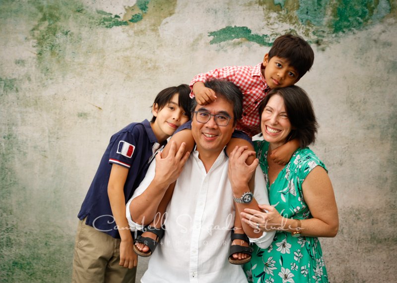  Portrait of family on abandoned concrete background by family photographers at Campbell Salgado Studio in Portland, Oregon. 