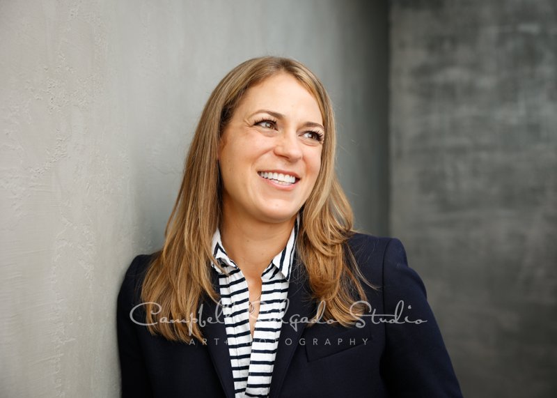  Commercial portrait of individual on modern grey background by commercial photographers at Campbell Salgado Studio. 
