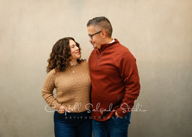  Portrait of couple on modern grey background by couples photographers at Campbell Salgado Studio in Portland, Oregon. 