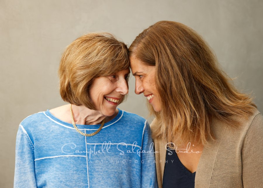  Portrait of mother and daughter on modern grey background by family photographers at Campbell Salgado Studio. 