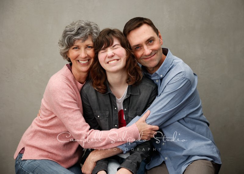  Portrait of family on modern grey background by family photographers at Campbell Salgado Studio in Portland, Oregon. 