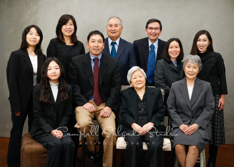  Portrait of multi-generational family on modern grey background by family photographers at Campbell Salgado Studio in Portland, Oregon. 