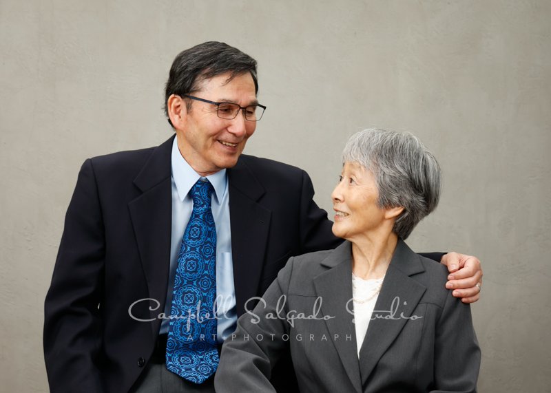  Portrait of couple on modern grey background by family photographers at Campbell Salgado Studio in Portland, Oregon. 