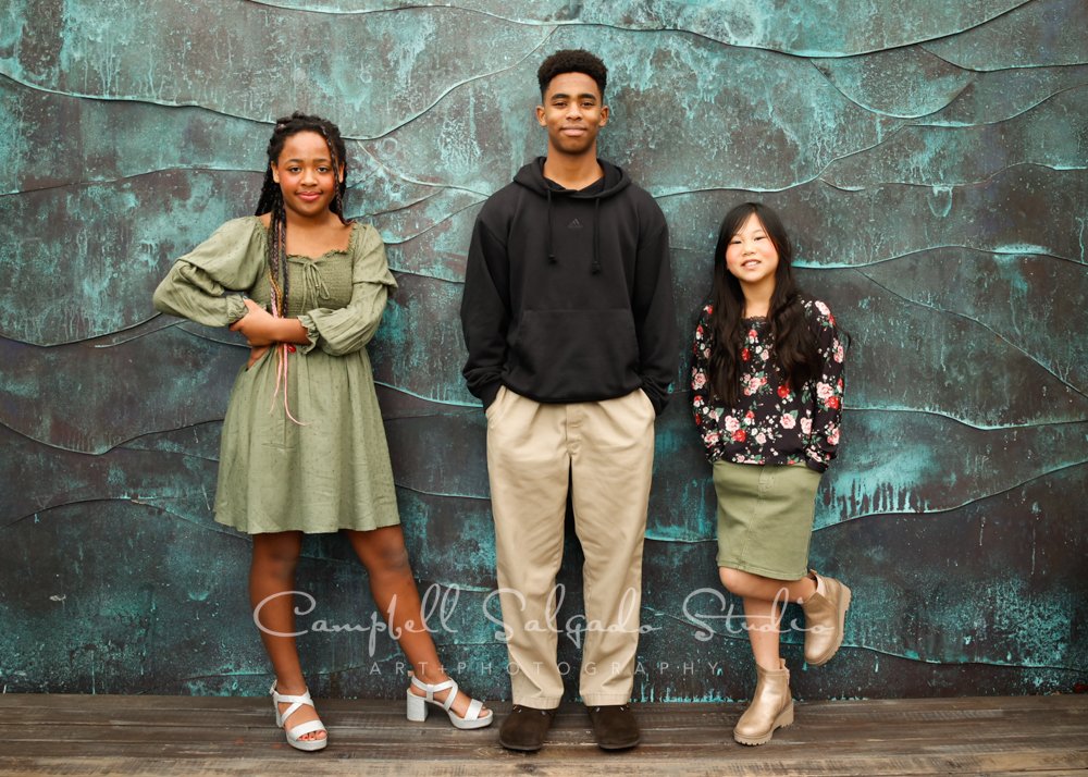  Portrait of siblings on ocean weave background by family photographers at Campbell Salgado Studio in Portland, Oregon. 