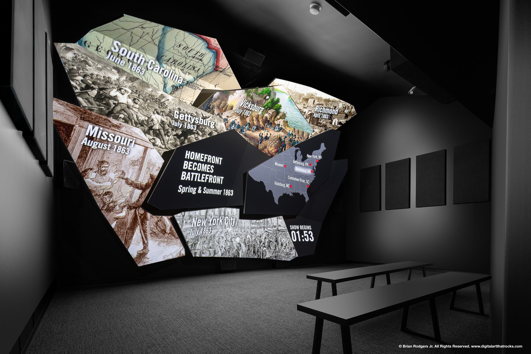 Darkened immersive museum theater exhibit photography featuring custom manufactured projection screens and audiovisual displays at The American Civil War Museum in Richmond, Virginia captured for experience design and museum fabrication portfolios.