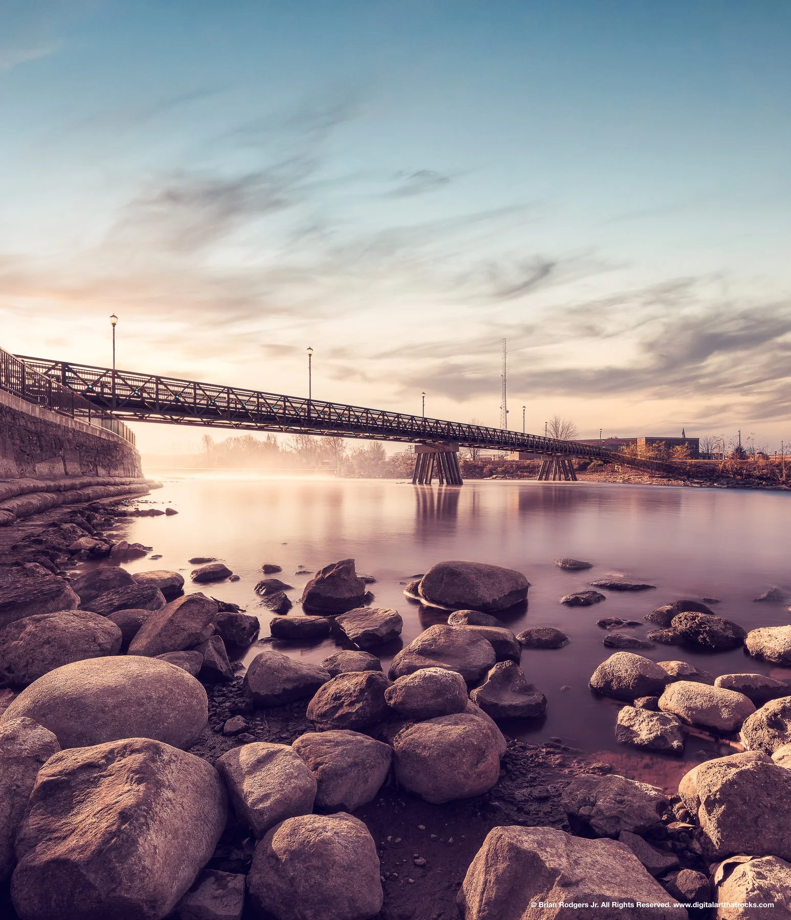 Fine art landscape architecture and civil engineering photography of a steel truss pedestrian bridge at Central Park in Mishawaka, Indiana, showcasing public infrastructure and waterfront development.