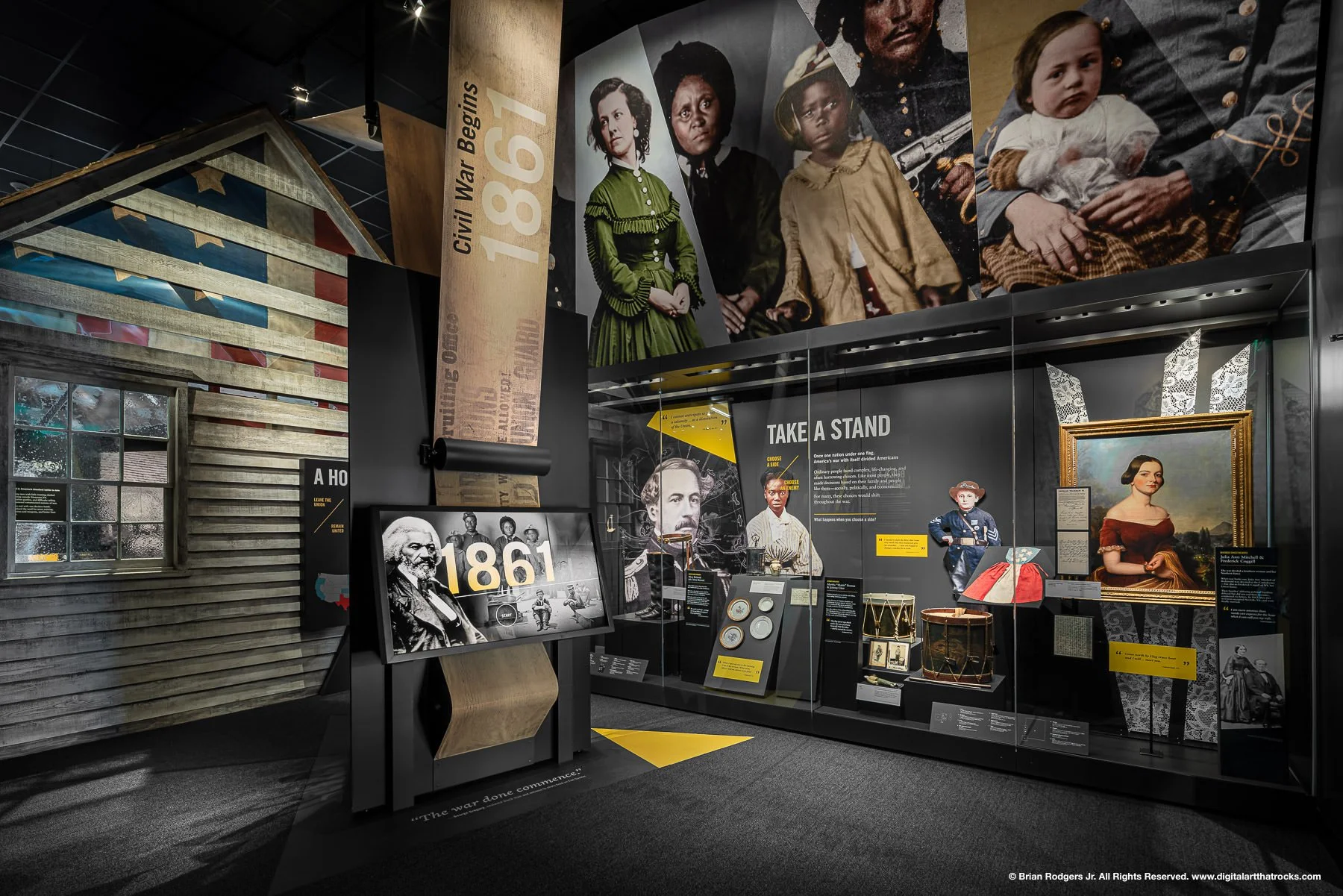Architectural museum interior photography of an immersive museum exhibit space. The American Civil War Museum features, artifacts in glass cases, custom projection and moving media, digital touch screen displays, and graphic design elements throughou