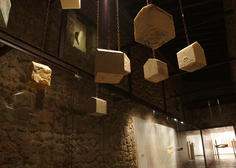 towns, 2013 - cement, polyurethane foam, chains, 18x18x22cm each