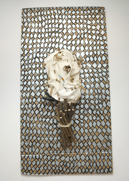   Eaassst  2013 Pleather, wood, bicycle inner tubes, acrylic, fake teeth, chicken wire, cardboard, and twine 71 x 38 x 13 inches 