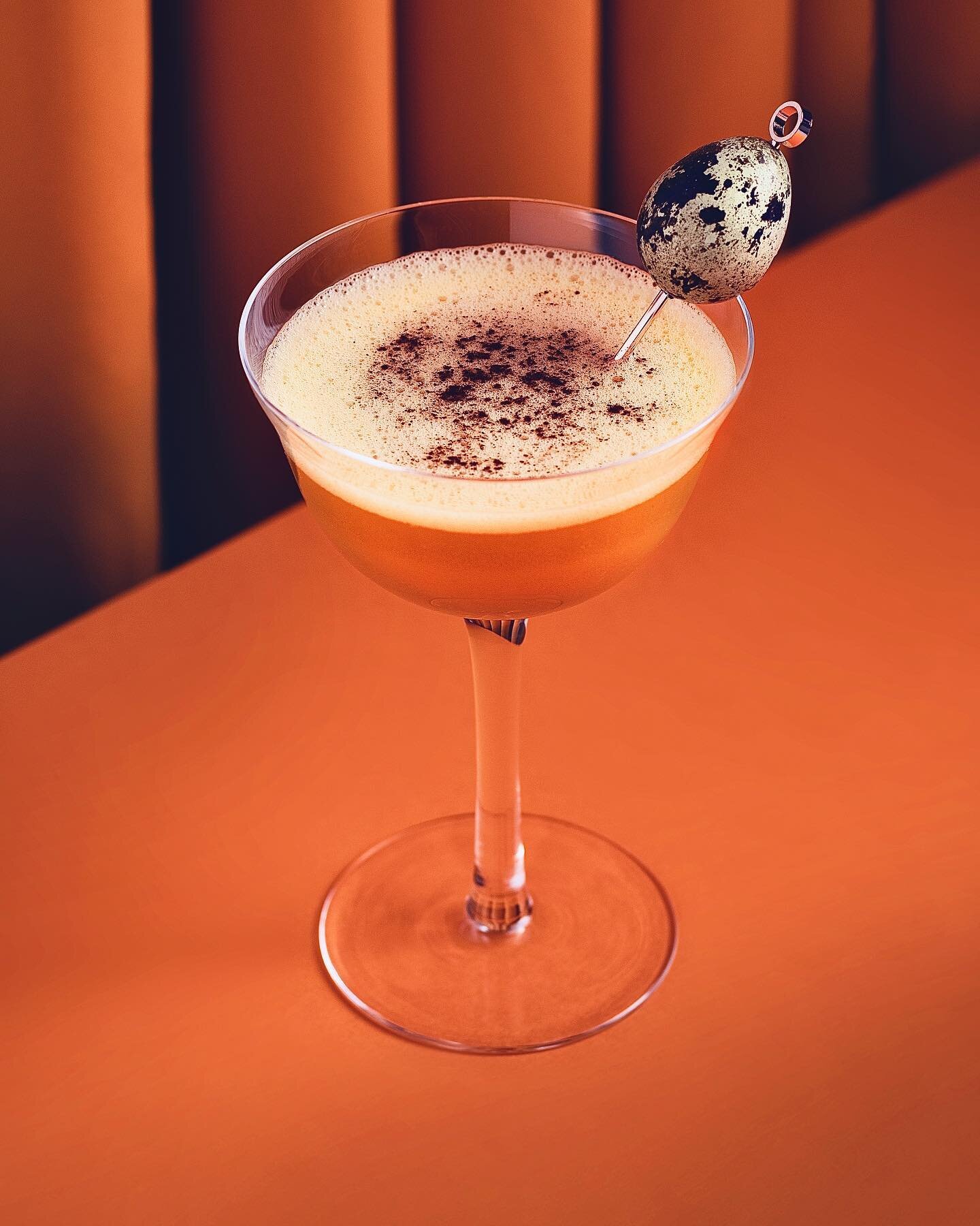 Happy Friday! Easter cocktail time🥕 try making a Carrot Cake Flip! Amazed at how @josue.allday was able to ad-lib this cocktail recipe from me saying &ldquo;I want to photograph a colorful Easter cocktail that has a little quail egg sitting on top&r