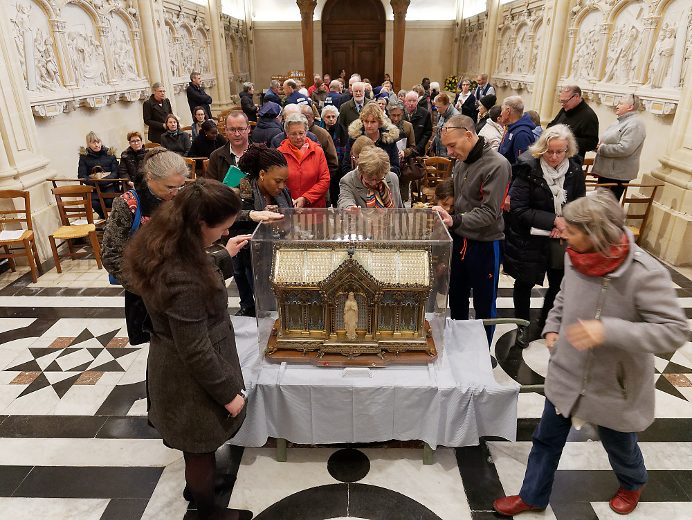 The faithful pray in the presence of the relics of St. Bernadette of Lourdes at the Monastery of the Visitation at Caen