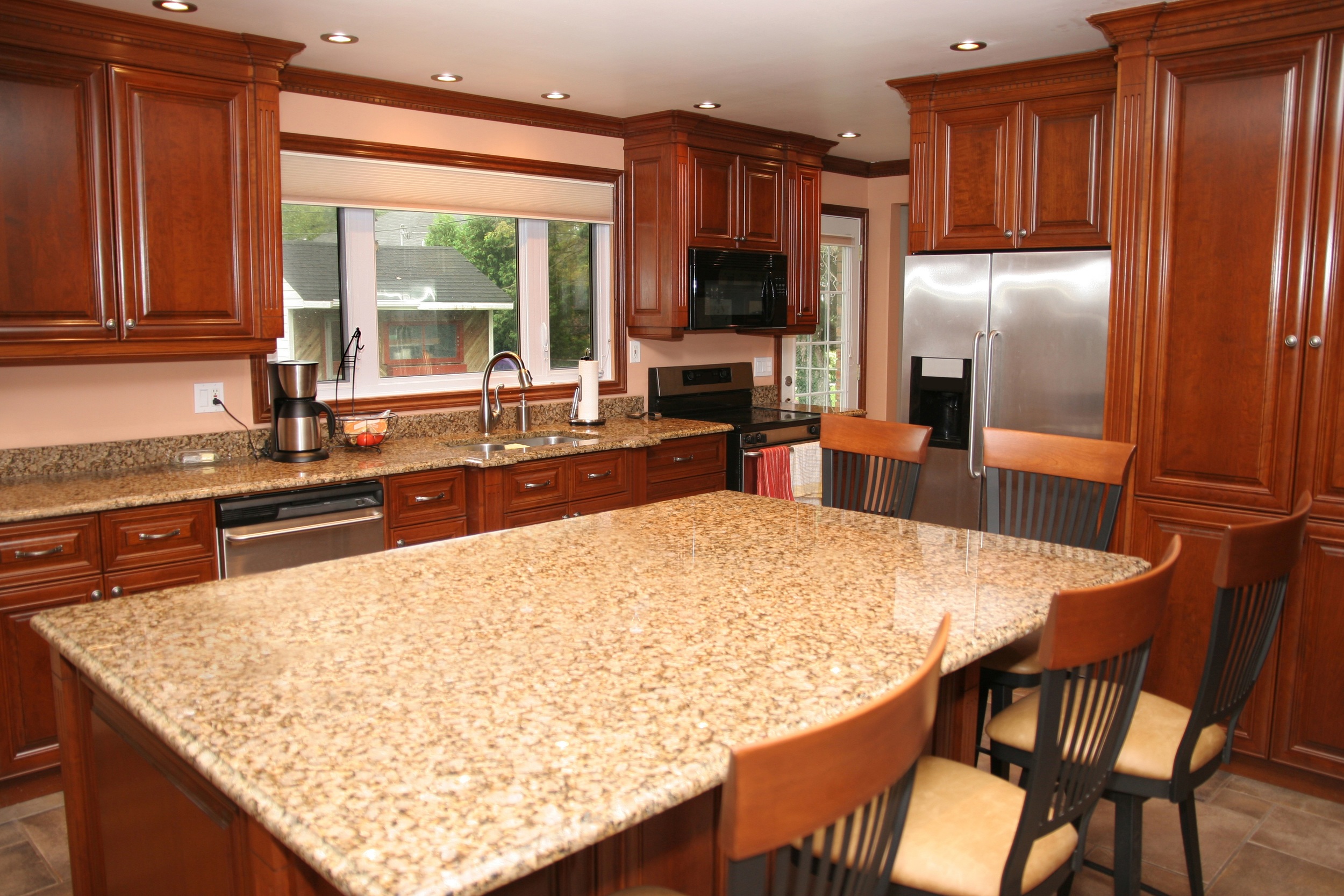 Clean Kitchen Countertops Cabinets Sink Tile Floor Granite Appliances.jpg