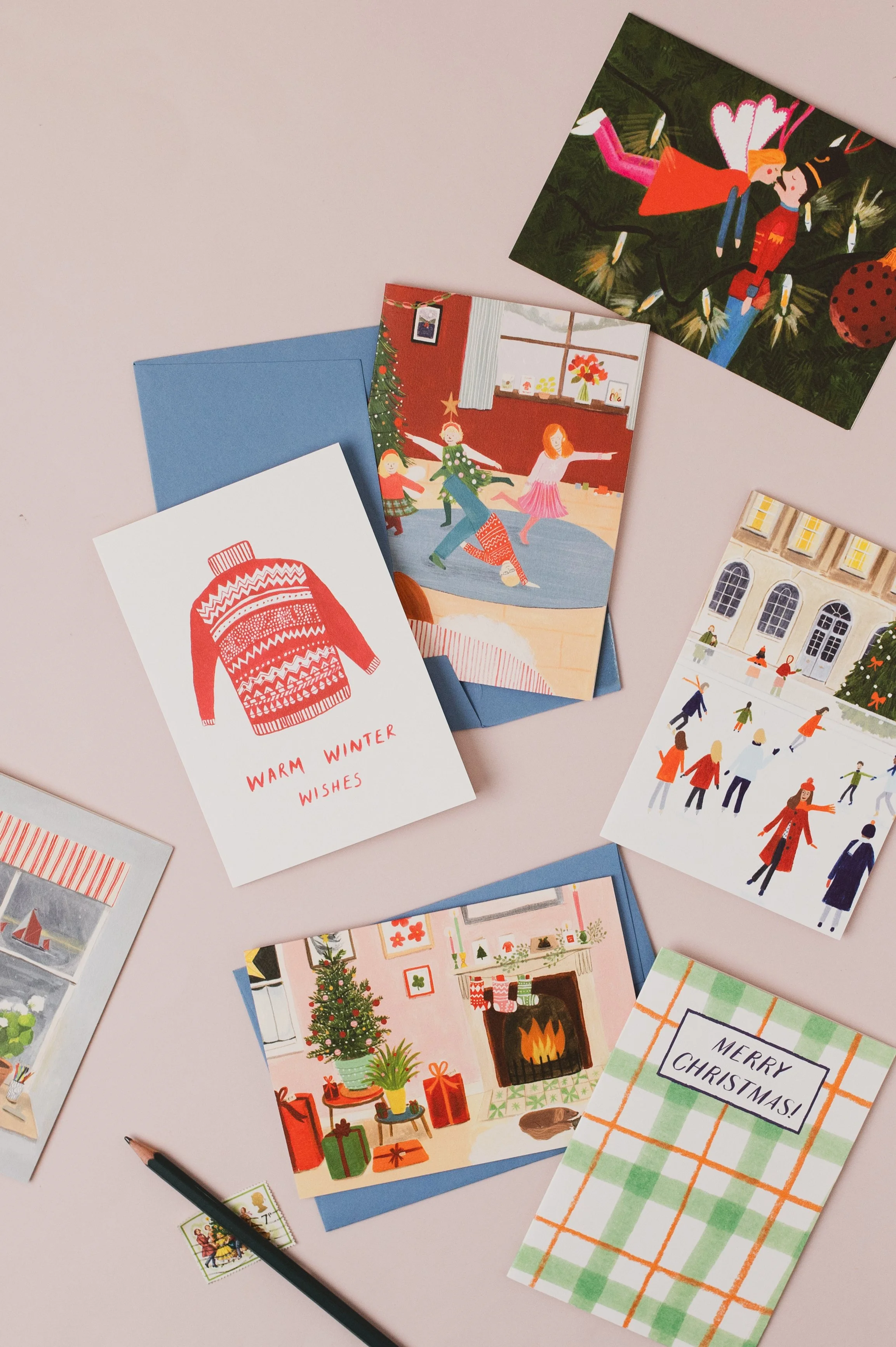 Bundle of hand-painted eco-friendly Christmas cards with pale blue envelopes