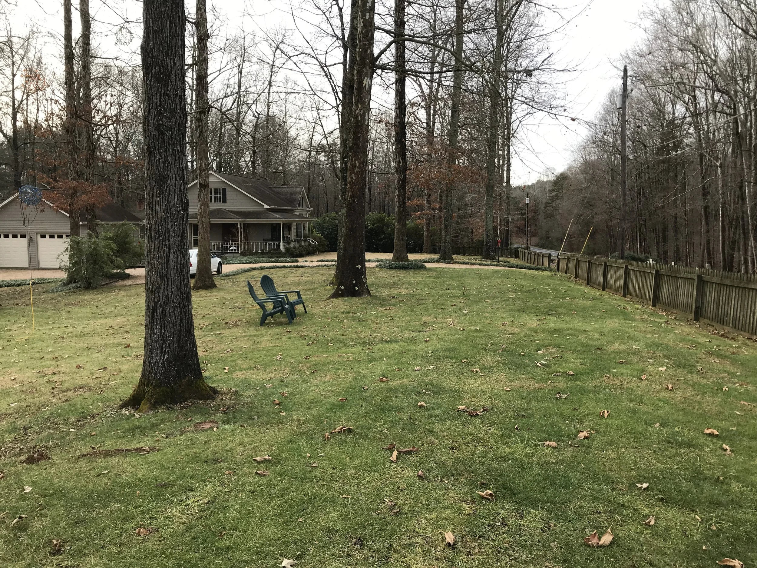 This is photo 11. Looking across the front of the side yard, just inside the front fence.