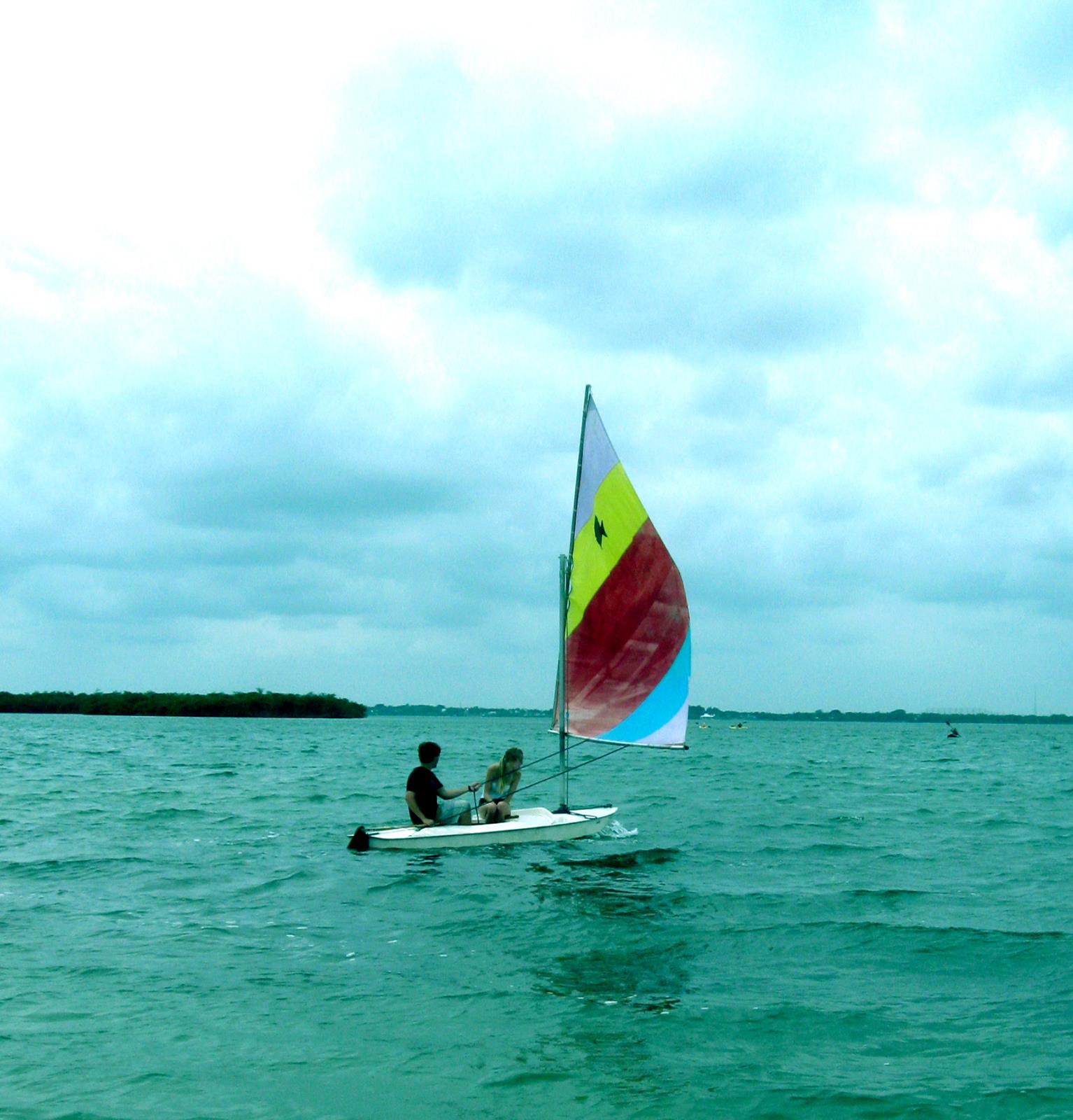 My wife and I filling the sail with wind, setting out for more practice runs. 