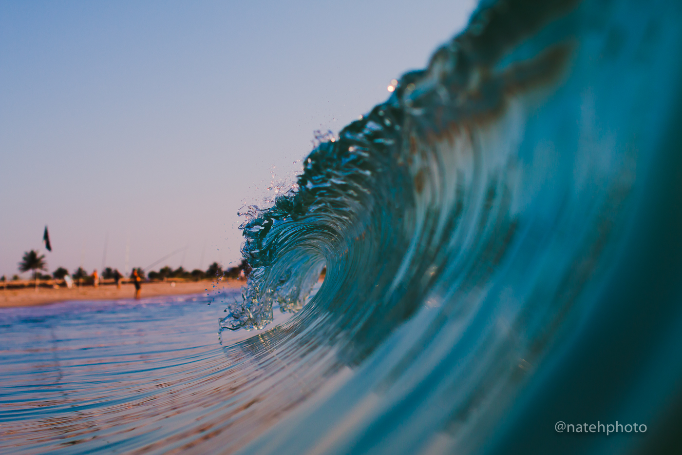 Fishermen in the background. I always wonder what they think I'm doing sticking my head into these tiny waves. 