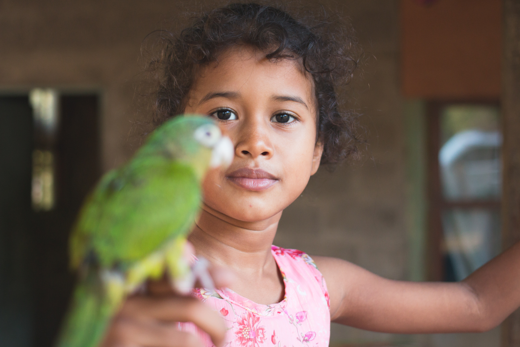 Girl and Her Parrot.