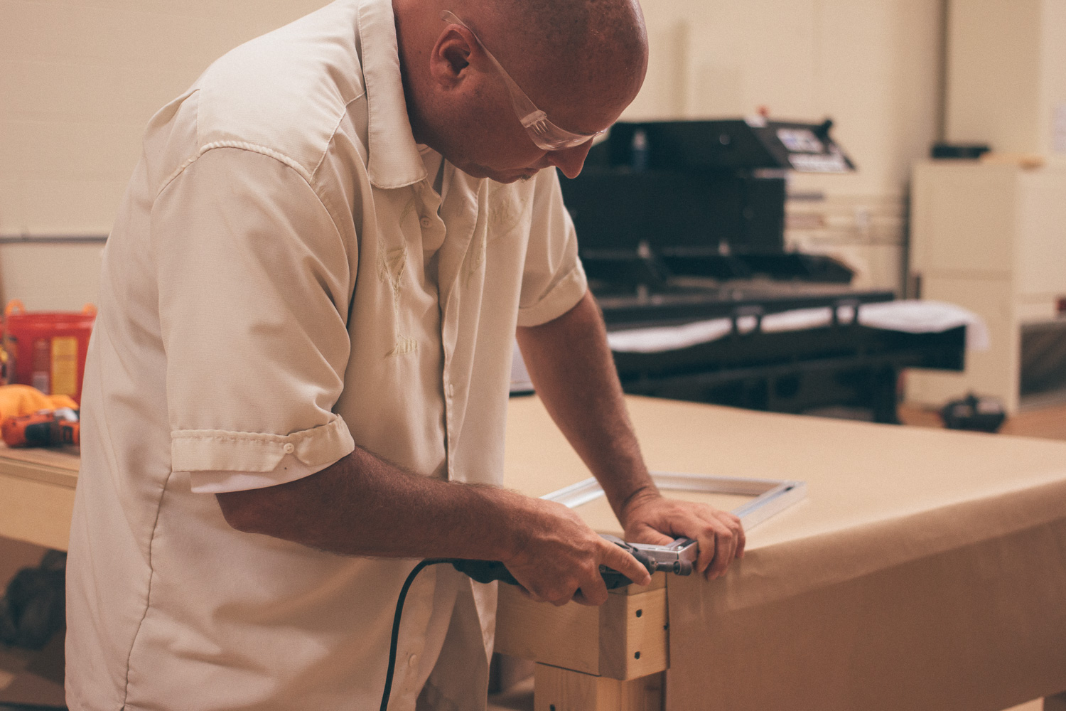 Jake on the finishing touches for the floating frame backing which will be placed on the print. 
