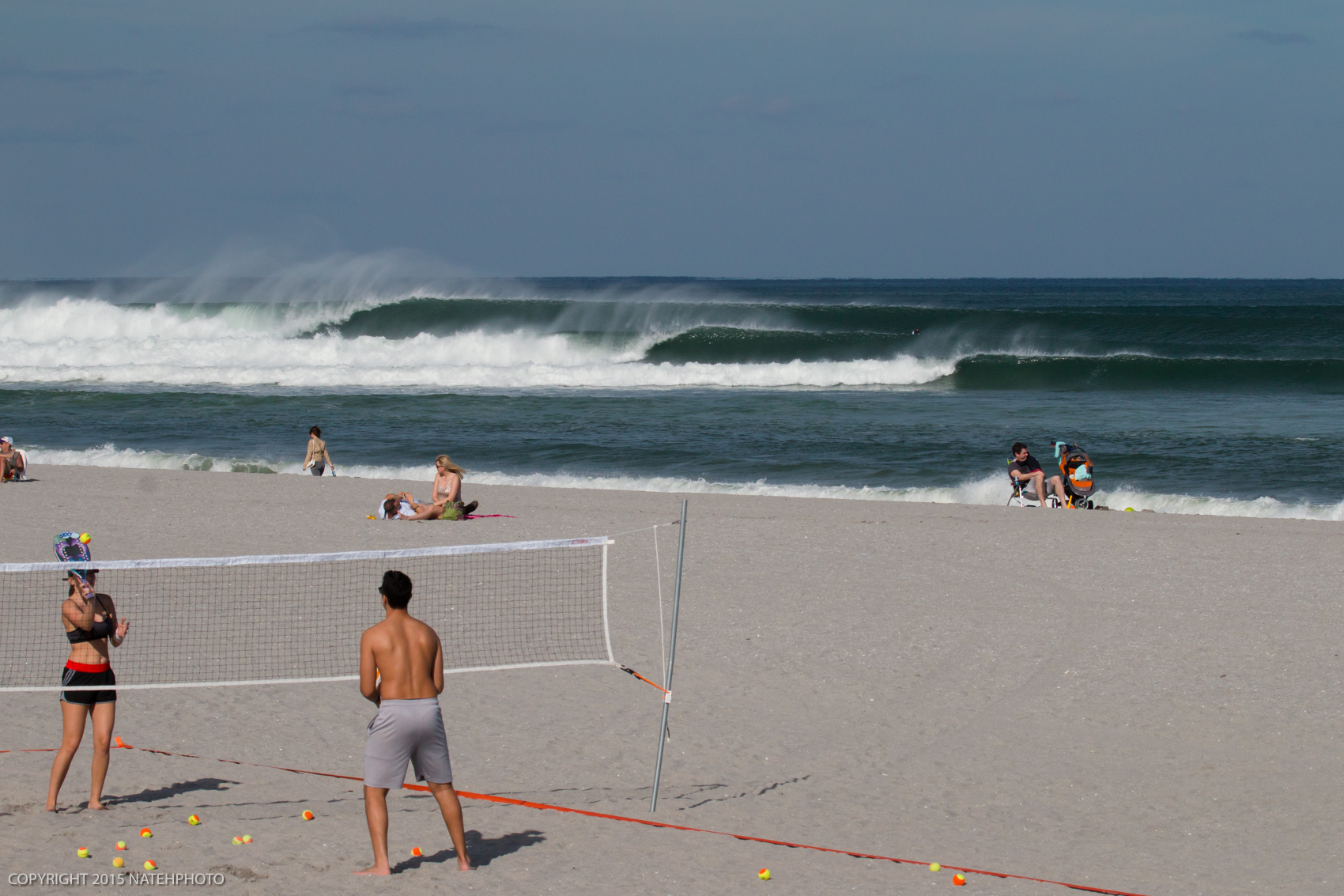 You know your a surfer when your absolutely confounded that no one on the beach in this photo seems to care even the slightest that there is absolutely perfect surf happening. 