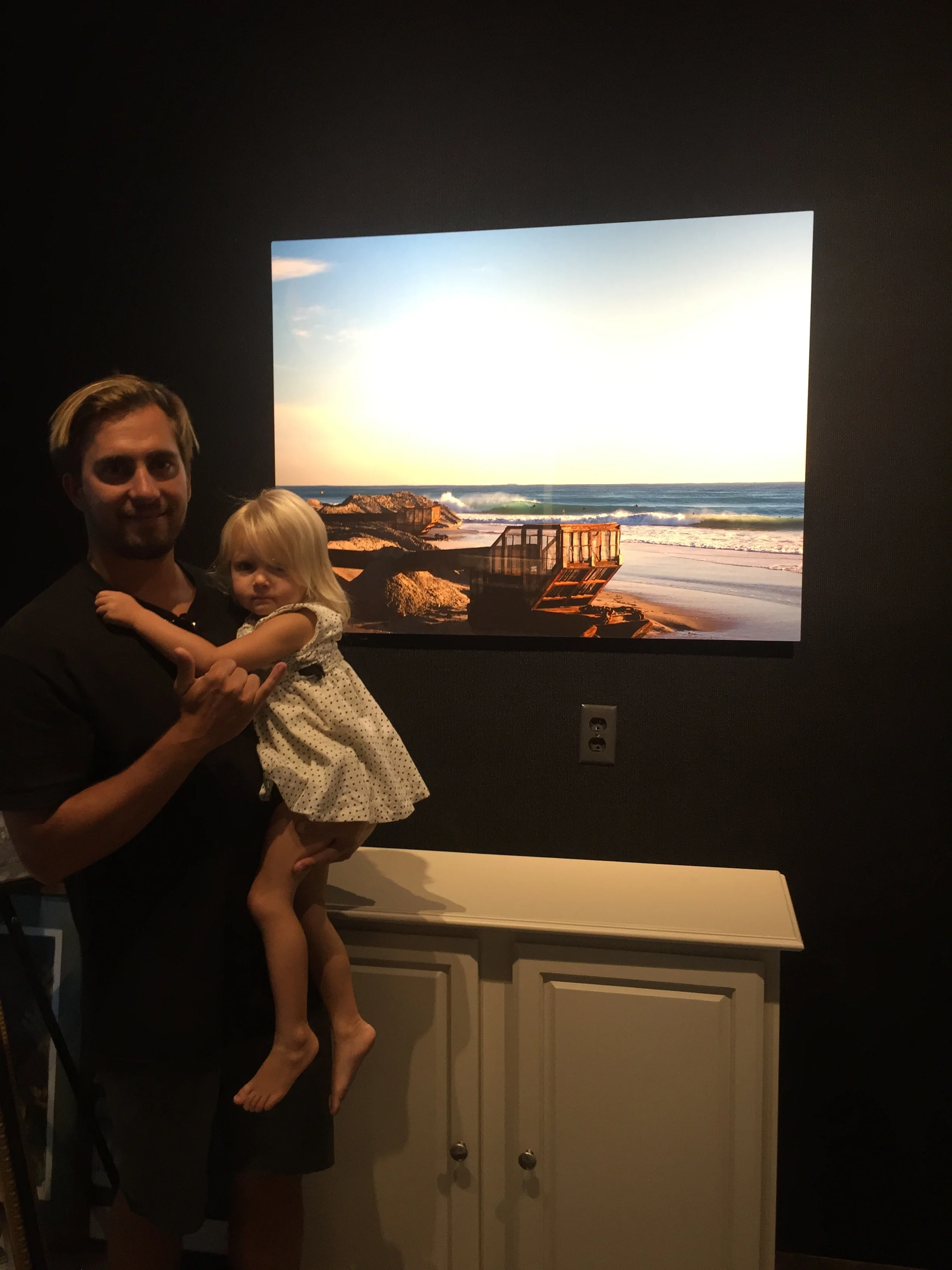 Nathaniel Harrington with "the Dredge", an aluminum print at An Image Evolution in Vero Beach, FL. 
