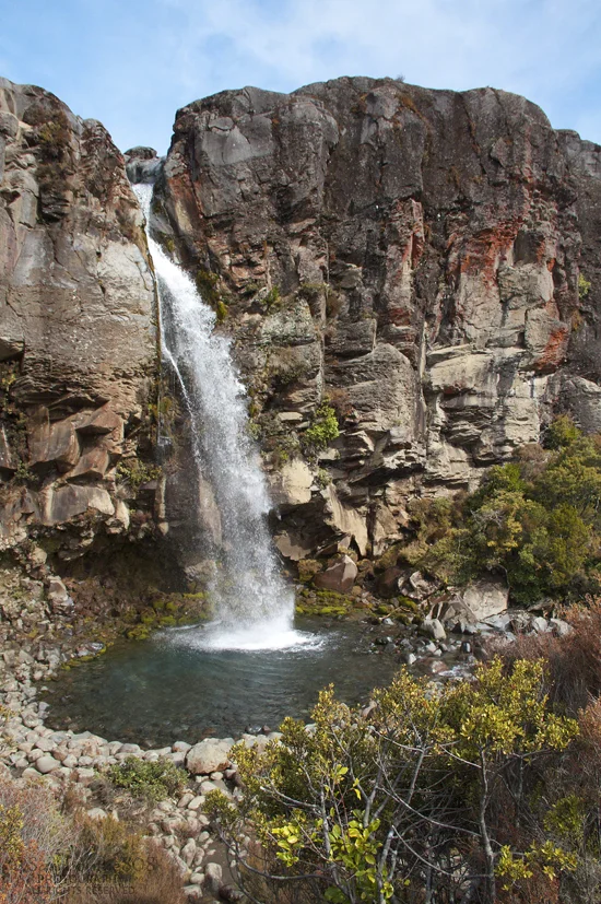 Lovely! Taranaki Falls is 20 meters tall (about 66 feet), falling off an andesite lava flow that erupted nearly 15,000 years ago from Mt. Ruapehu. I and several other hikers stop to sit atop stone benches, taking in the waterfall's beauty. I imagine sitting at the edge of the pool and submerging my feet during the heat of summer. It's a beautiful spot.