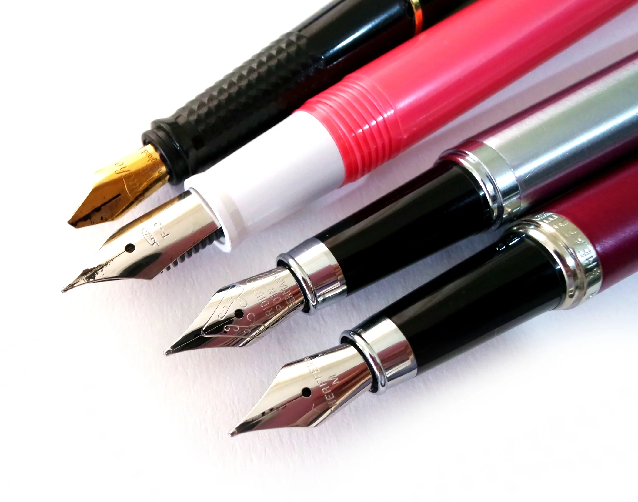 Fountain pen cabal: Panache, Sailor, nameless fountain pen from National Bookstore, and Sheaffer