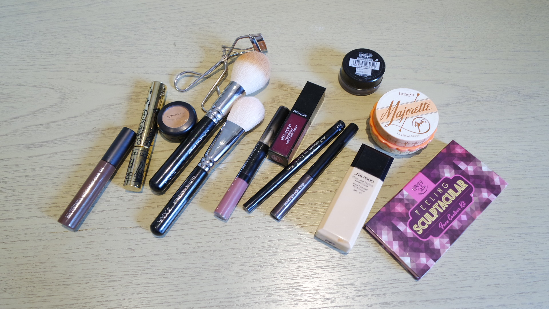  I have here the MAC Pro Longwear Waterproof Browset in Quiet Brunette, Fairydrops Platinum Mascara, MAC Studio Finish Concealer, Zeova brushes, Make Up For Ever Liquid Lip Color in Light Rosewood, Revlon Colorstay Moisture Stain, Heavy Rotation Liquid Eyeliner, Make Up For Ever Aqua Liner in Diamond Grey, Shiseido Sheer and Perfect Foundation, Maybelline Bad To The Bronze Cream Eyeshadow, Benefit Majorette Blush, and Happy Skin Feeling Sculptacular Contour Kit.