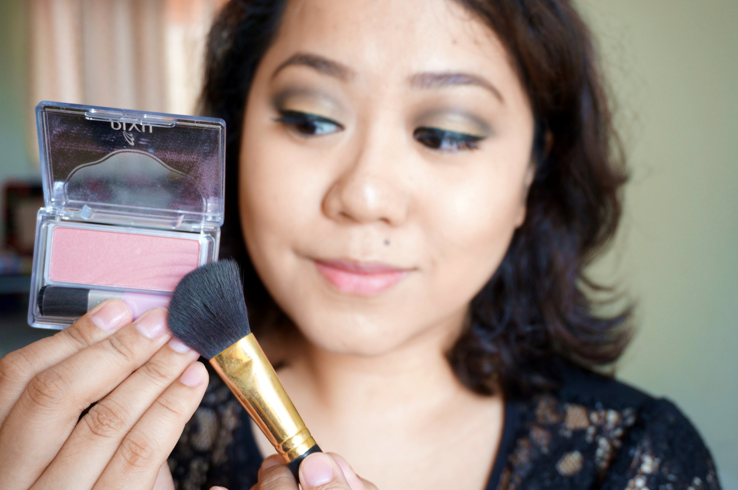  Step 12: Layer on the Pixy Passion Roses Brush (P285) on the apples of your cheeks. This gives a natural flush with just a&nbsp;hint of shimmer. It's very pretty and understated! 