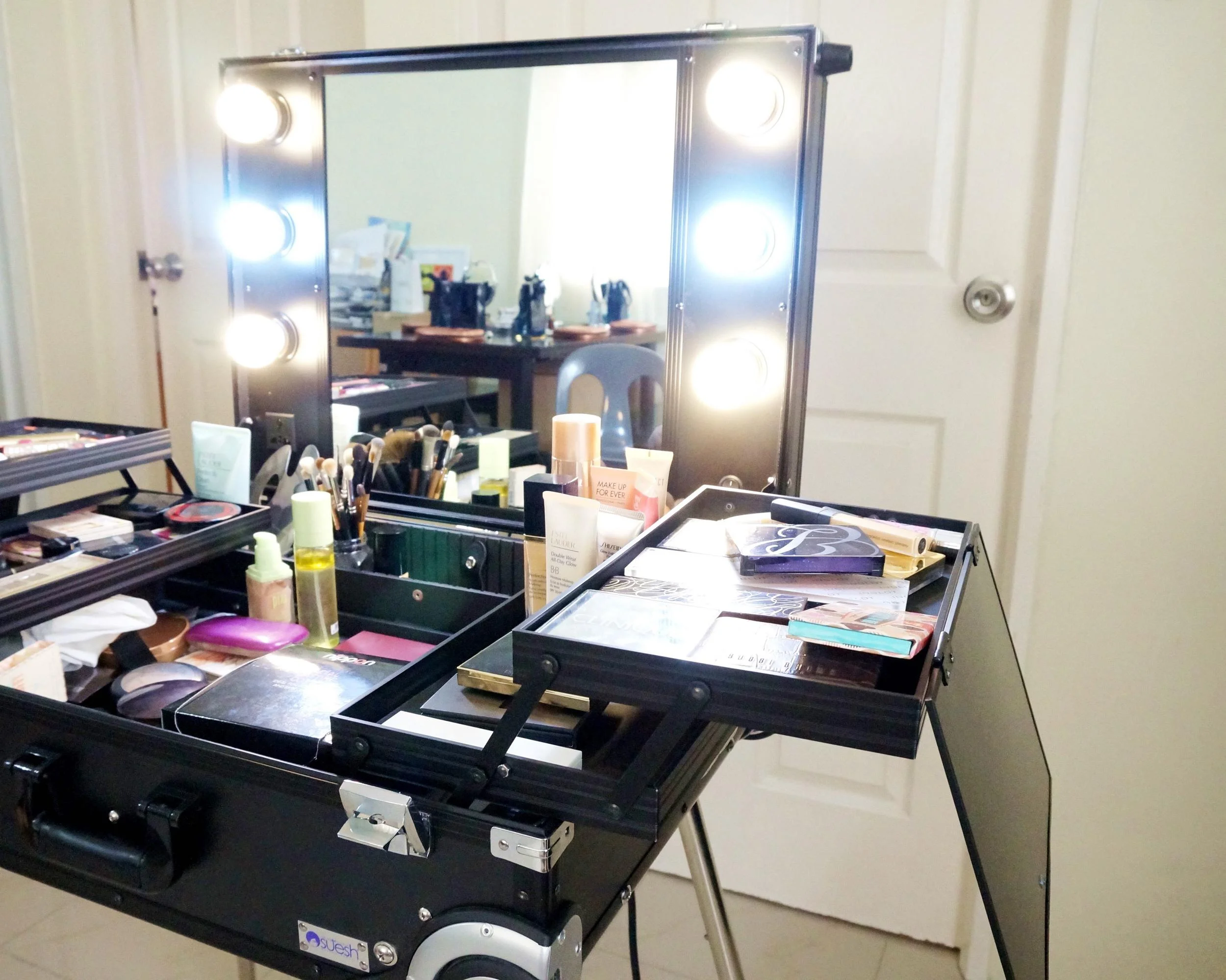 The LED lights never heat up - they also come in yellow and blue, to mimic natural light. There's also a plug on the bottom left side of the mirror for curling irons, blow driers, etc.