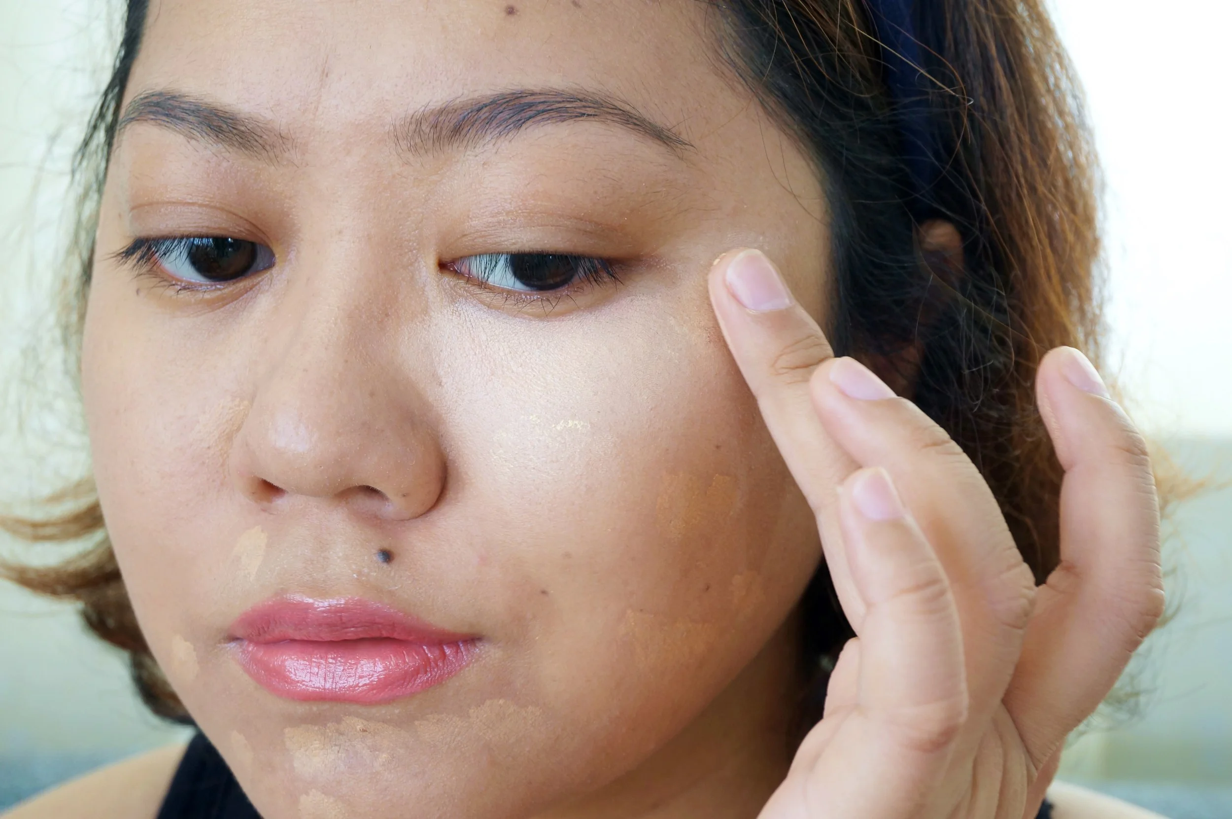 Here I'm applying a mix of the yellow and pink concealer. When set with powder, it looks natural and makes my eyes appear fresh!