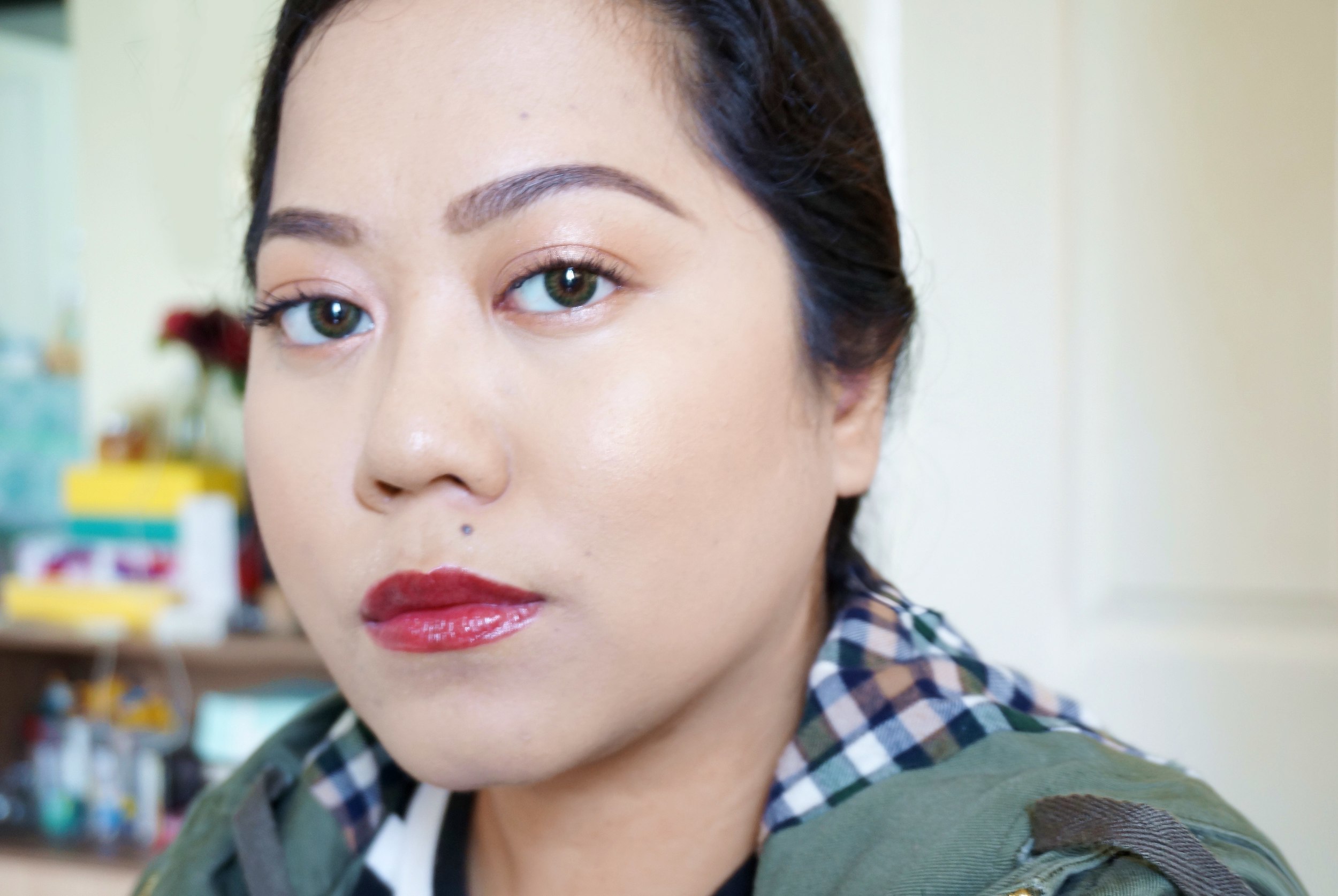 Here's a light way to wear dark lipstick: place a light pink shadow all over your lids, load on the lashes, and highlight your cheekbones. Looks fresh right? Try it one time. ;)
