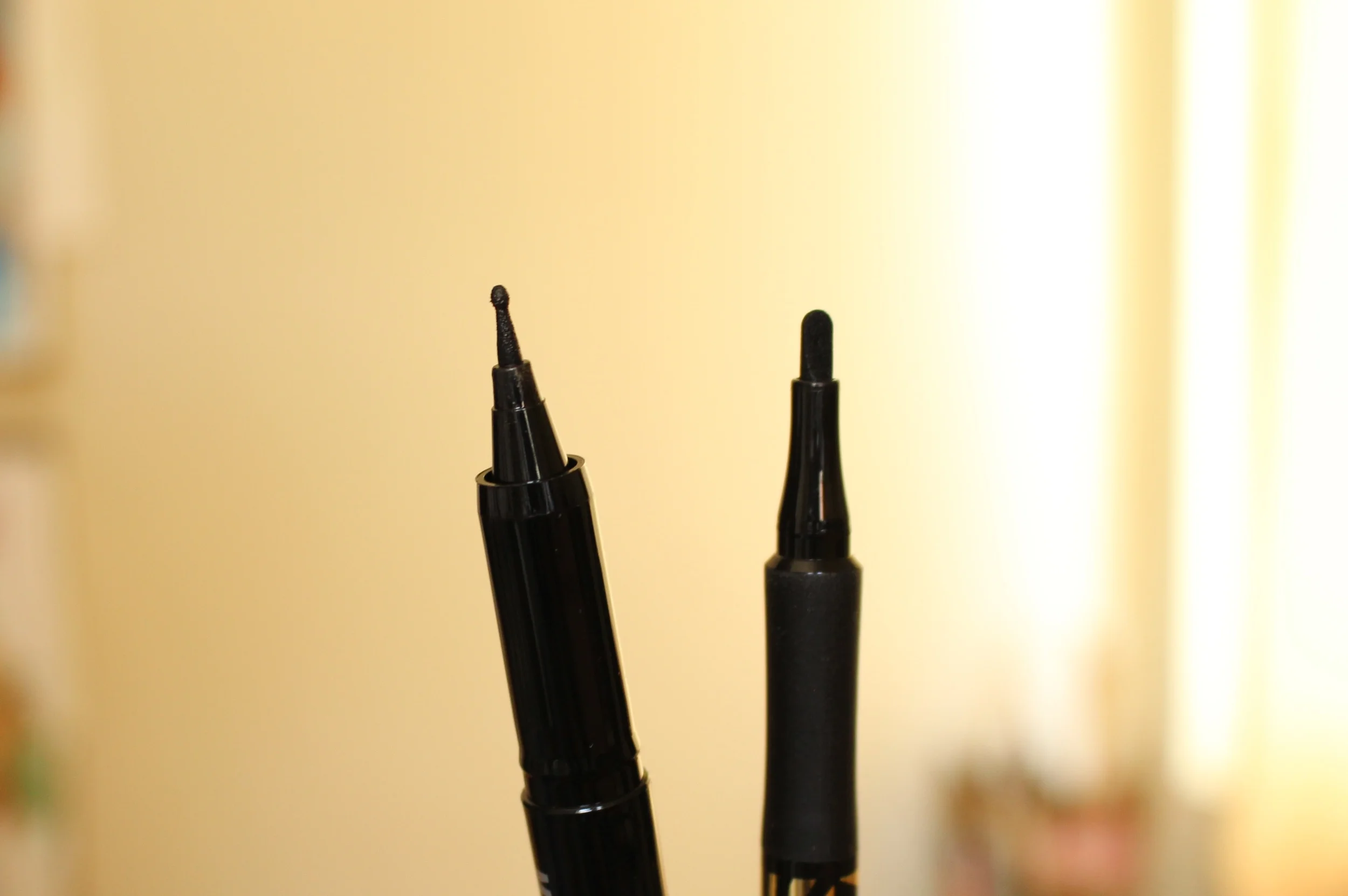 Left: Holika Holika Magic Pole Eyeliner, Right: Masx Factor Masterpiece Liner