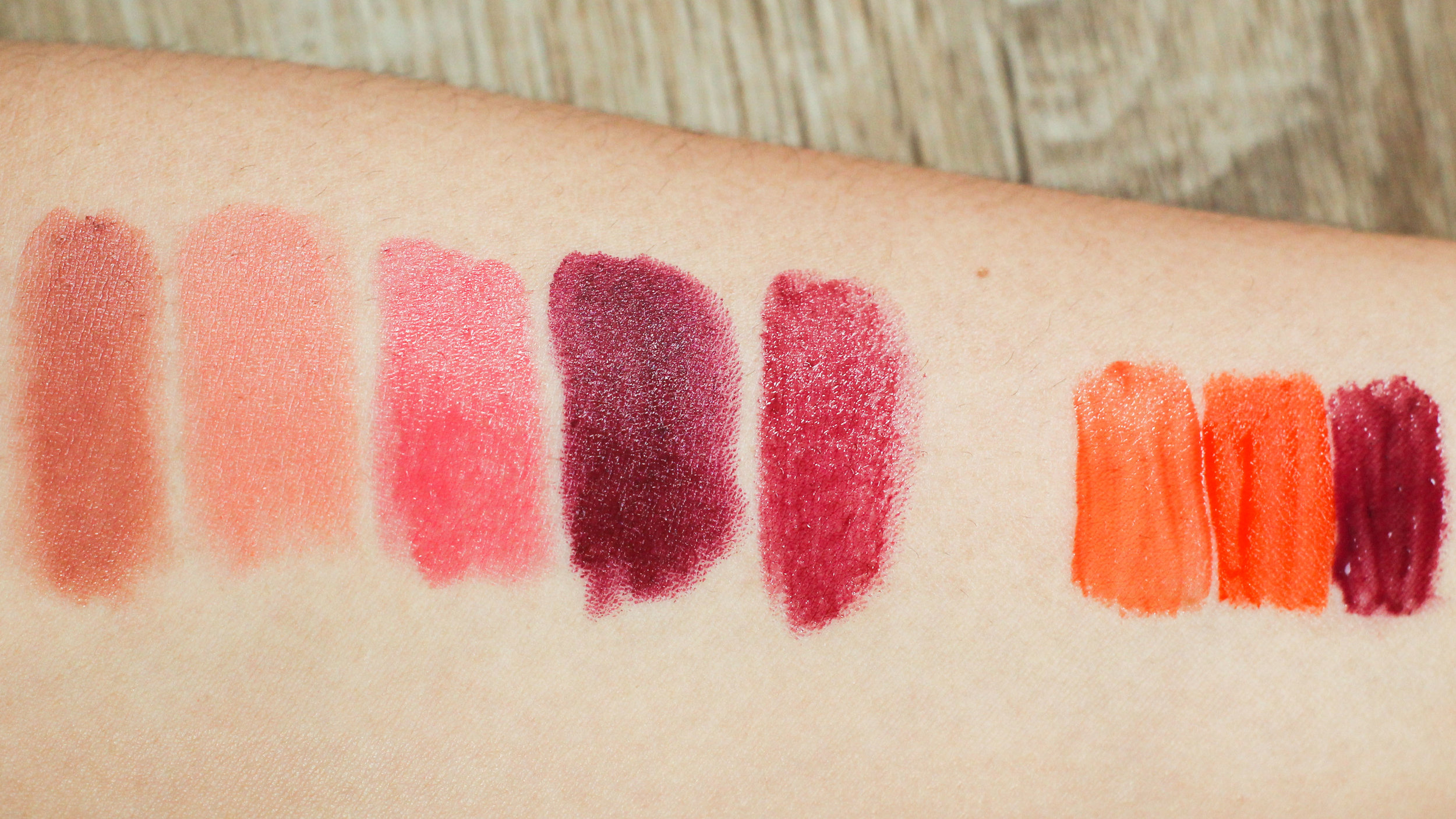 Burt's Bees Lipstick in Suede Splash, Pixi by Petra Shea Lip Balm, L'Oreal Glossy Balm in Innocent Coral, NYX Butter Lipstick in Moonlit Night, Bobbi Brown Nourishing Lip Color in Berry, Peripera Peri's Ink in shade 1, Chateau Labiotte Wine Lip Tint in OR01, Revlon Colorstay Moisture Stain in Parisian Passion