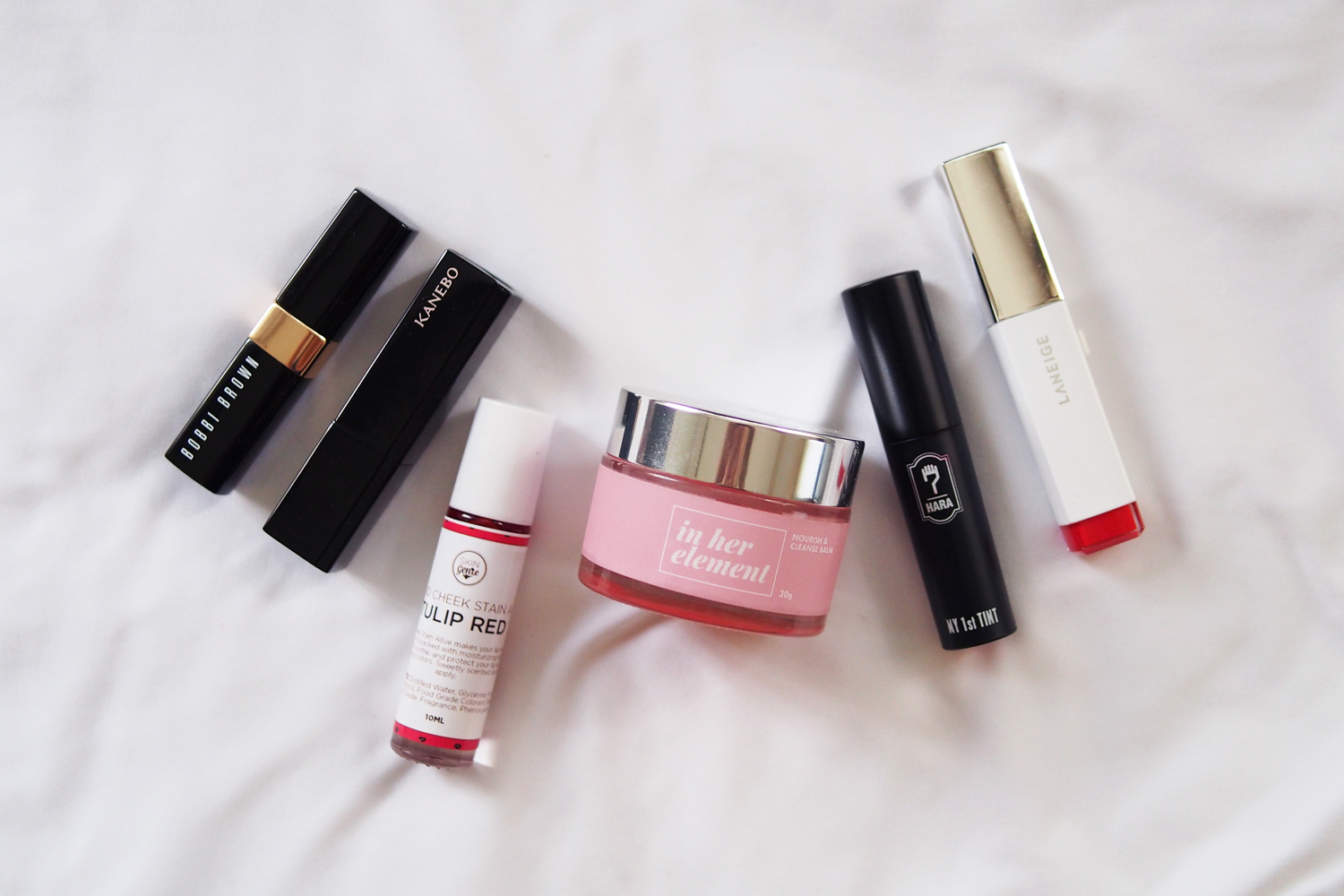 Bobbi Brown Nourishing Lip Color in Island Pink (P1,400), Kanebo Moisture Rouge in 05 Core Red (P2,100), Skin Genie Lip and Cheek Stain Alive in Tulip Red (P80 via BeautyMNL.com), In Her Element Nourish & Cleanse Balm (P595), 7Hara My 1st Tint in Maple Red (P350 via Althea Korea), Laneige Two-Tone Lip Bar in No.5 Daring Darling (~P1,200)