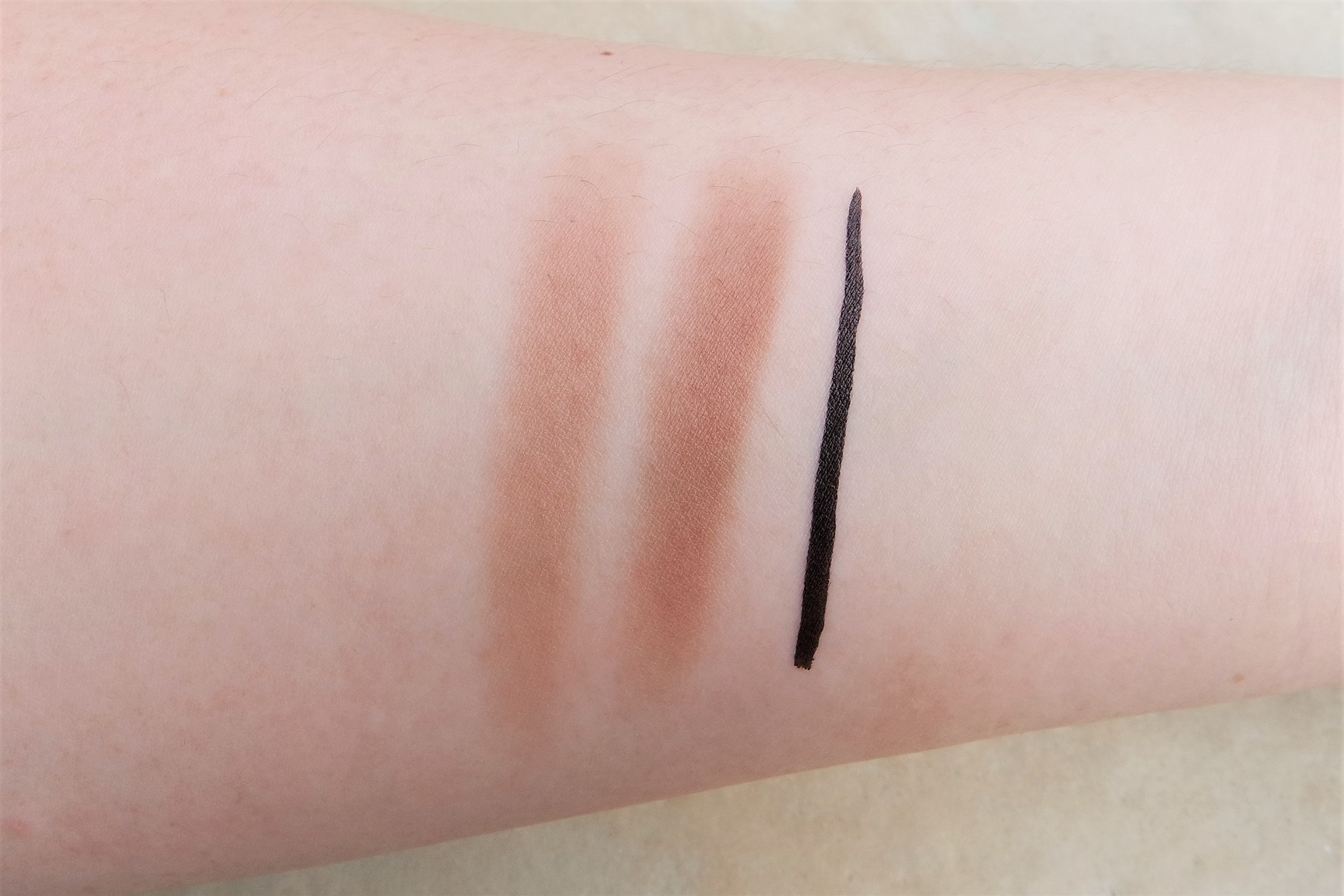 From left: eyebrow powder duo and eyeliner pen