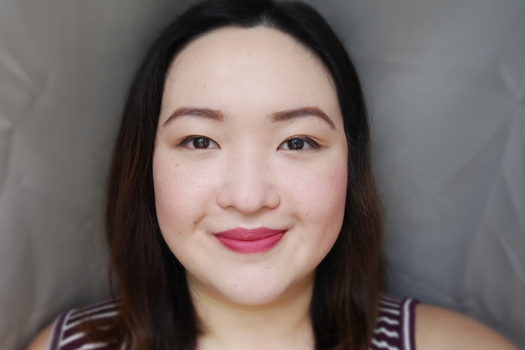 Wearing Clio Mad Matte Lip in Russet Rose