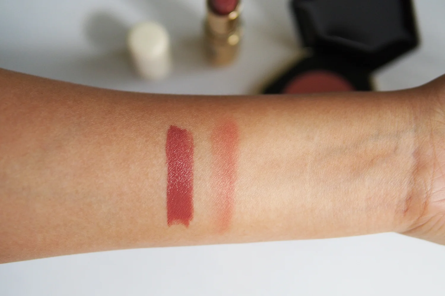 From left: Cream Lip Color in Brunette Ambition , Pure Radiance Powder Blusher in Soft Russet