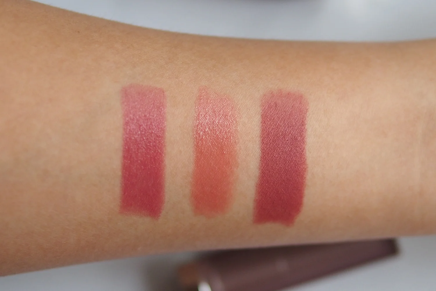 From left: Estée Lauder Pure Color Love Edgy Cremes Lipstick in Strapless , Wet n' Wild Megaslicks Balm Stain in Rico Mauve , Maybelline Creamy Mattes in Touch of Spice