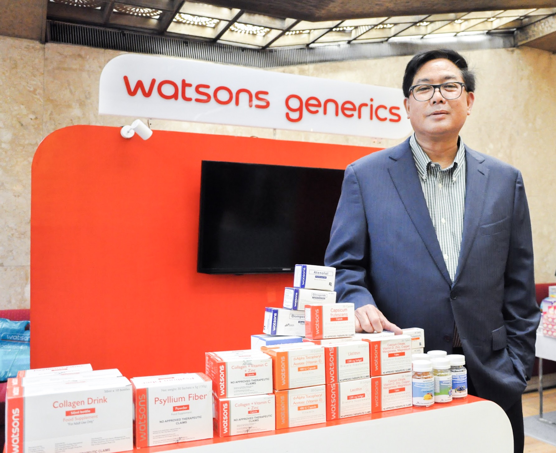 Danilo Chiong, Health Business Director of Watsons Philippines, showcases the brand's Generics line