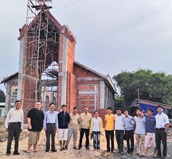 New church building and the construction crew.