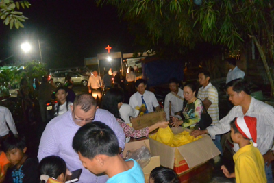 Distributing gifts and candy after the service.
