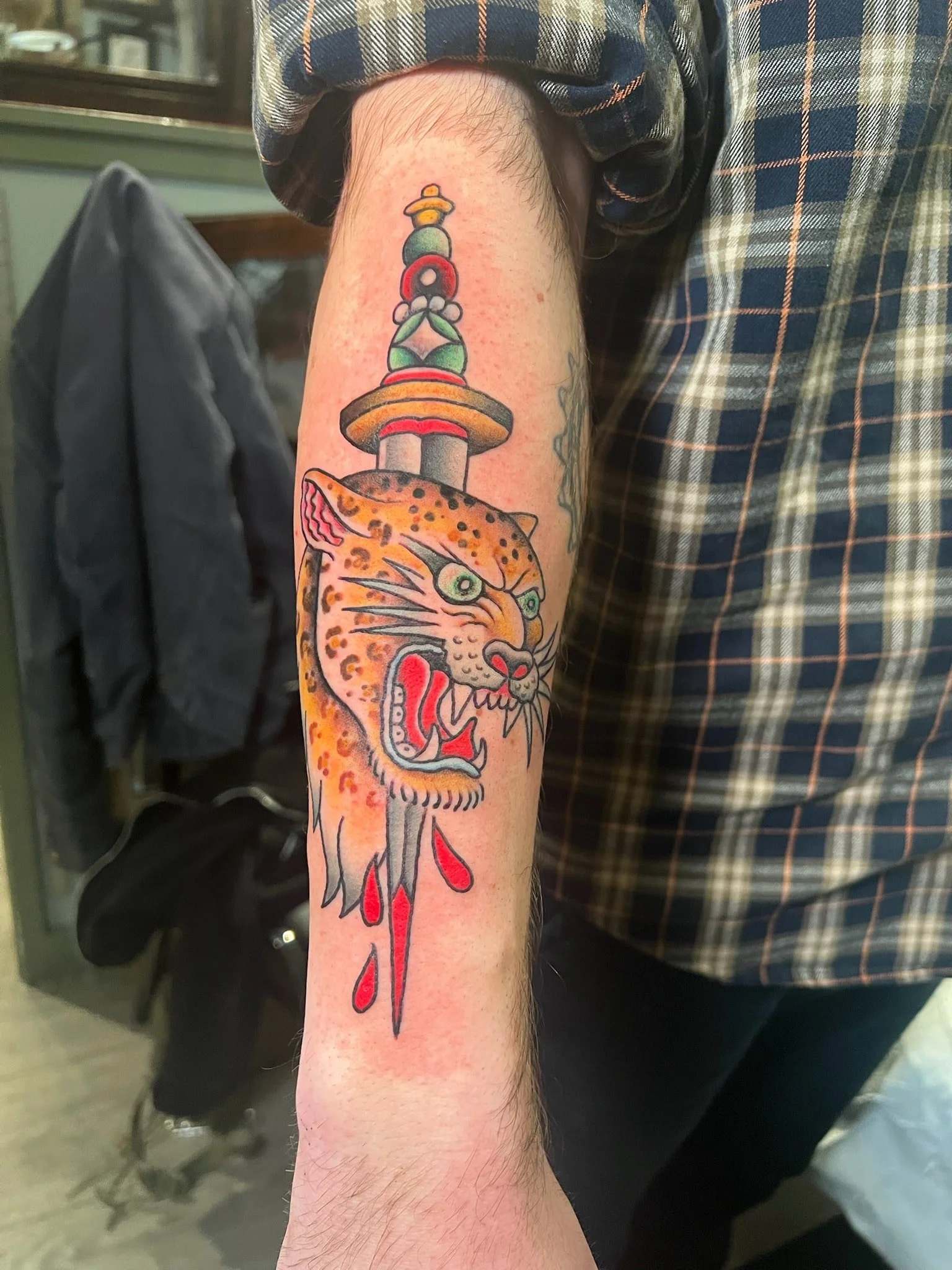 traditional-dagger-panther-head-tattoo-chicago-great-lakes-tattoo.jpeg