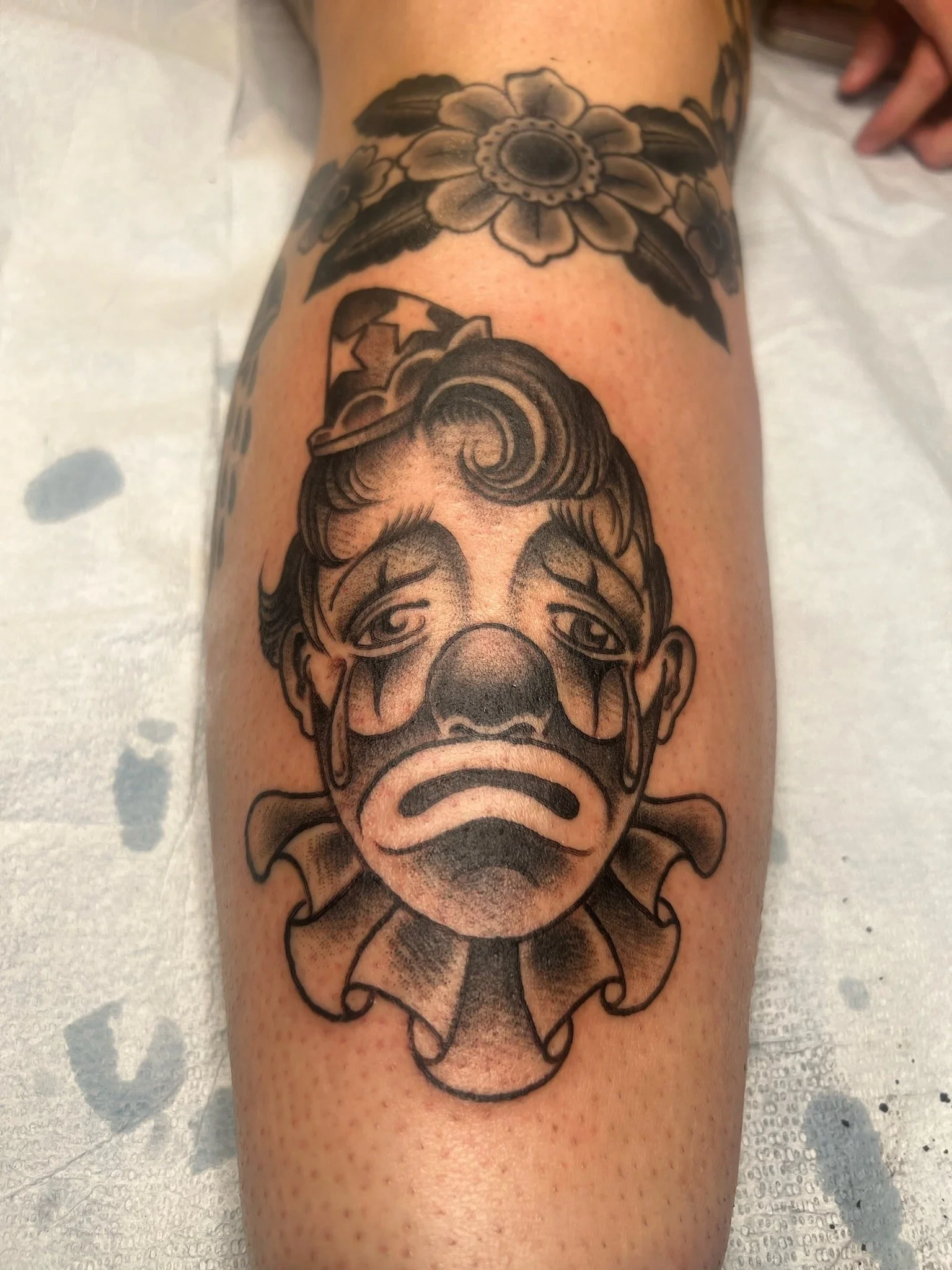 traditional-crying-clown-face-tattoo-great-lakes-tattoo-chicago.jpg