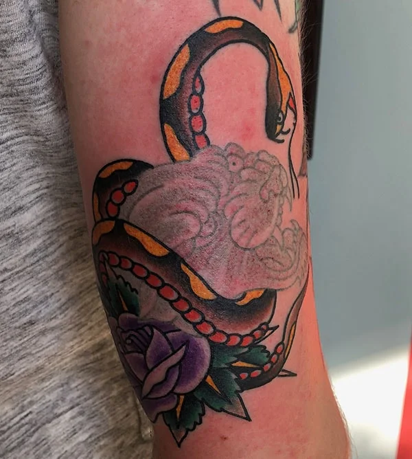 Nick Colella tradtitional ghost panther and snake tattoo -min.jpg