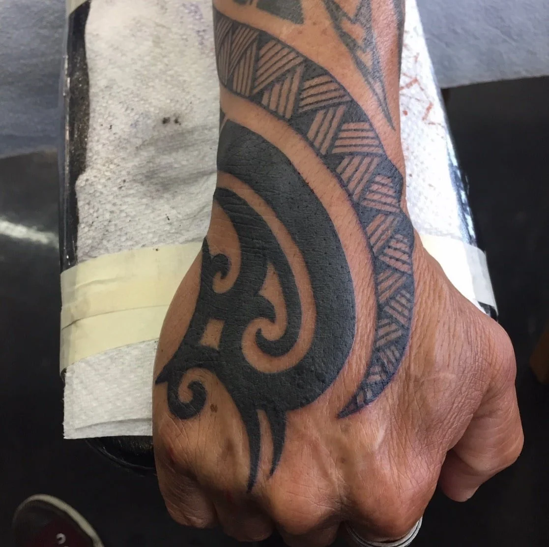 Tribal tattoo on hand Chip Douglas Chicago 