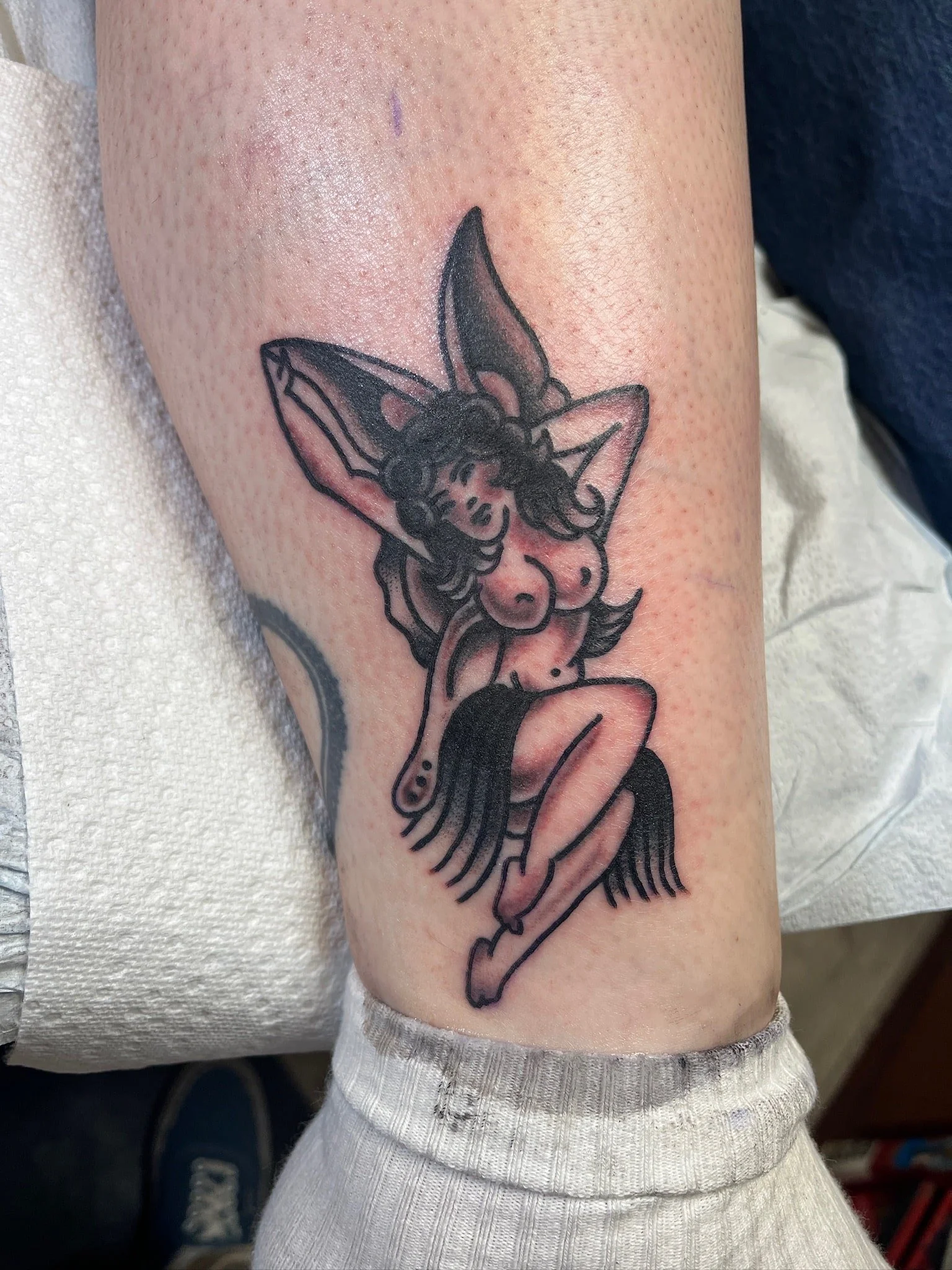 pinup-butterfly-girl-traditional-black-grey-tattoo-leg.jpg