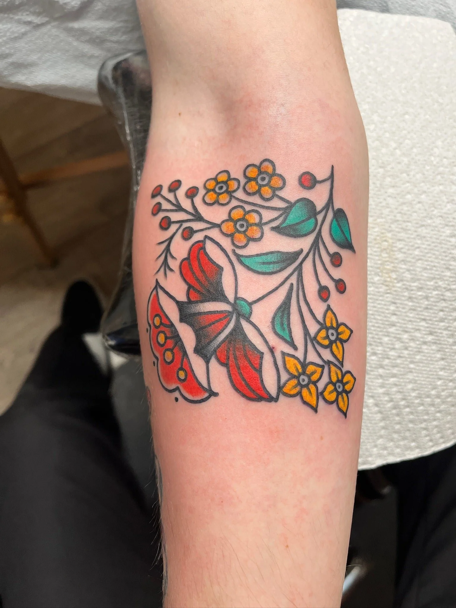 traditional-butterfly-floral-tattoo-arm.jpg