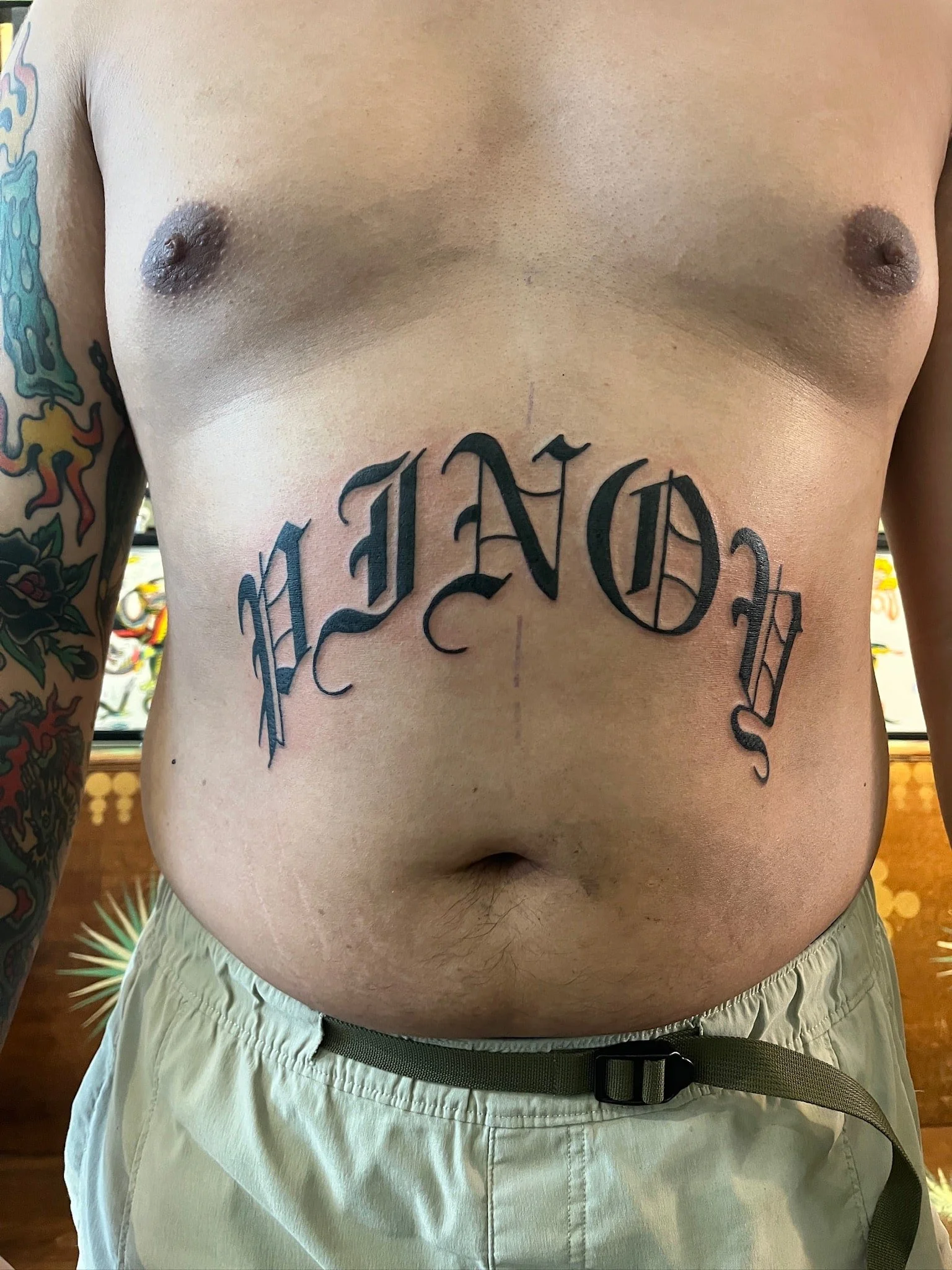 blackletter-pinoy-script-stomach-tattoo.jpg